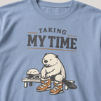 Close-up of a beaver preparing snowboard boots beside a helmet and goggles under “Taking My Time” lettering.