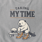 Close-up of a beaver preparing snowboard boots beside a helmet and goggles under “Taking My Time” lettering.