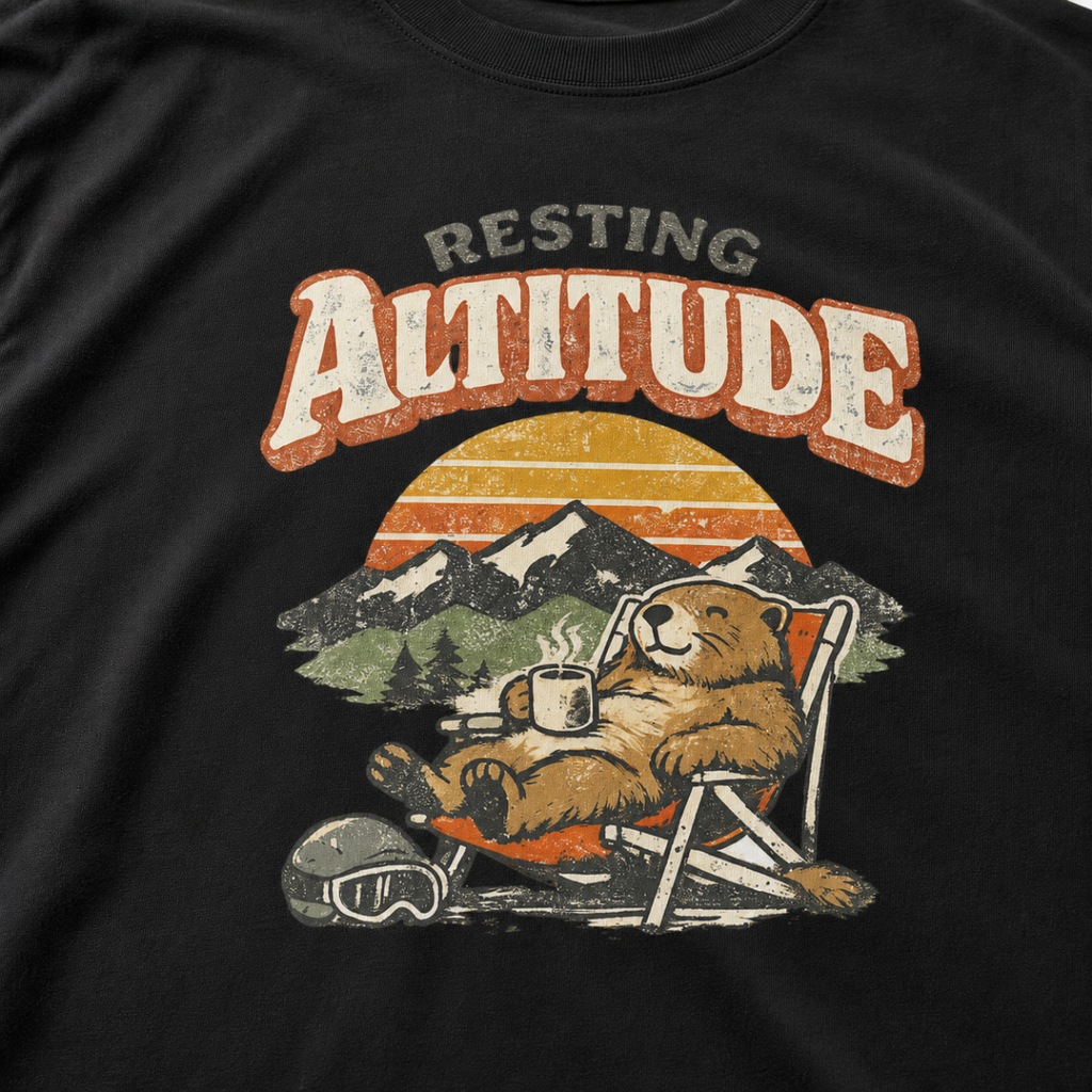 Close-up of a relaxed marmot reclining in a chair with a steaming mug beneath “Resting Altitude” lettering and a mountain sunset.