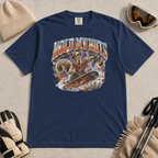 Navy blue t-shirt featuring a squirrel snowboarding through flying acorns beneath the words “Hold My Nuts.”