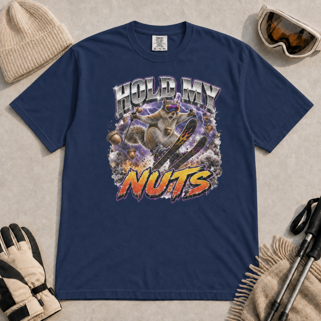 Navy blue t-shirt featuring a squirrel performing an aerial ski trick beneath the words “Hold My Nuts.”