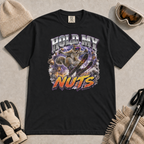 Black t-shirt featuring a squirrel performing an aerial ski trick beneath the words “Hold My Nuts.”