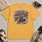 Mustard yellow t-shirt featuring a squirrel snowboarding through flying acorns beneath the words “Hold My Nuts.”