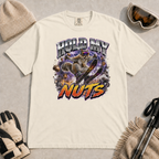 Ivory white t-shirt featuring a squirrel performing an aerial ski trick beneath the words “Hold My Nuts.”
