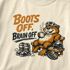 Close-up of a relaxed marmot holding a steaming mug beside ski boots and a helmet with the words “Boots Off, Brain Off.”