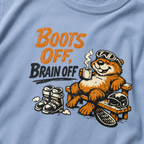 Close-up of a relaxed marmot holding a steaming mug beside ski boots and a helmet with the words “Boots Off, Brain Off.”