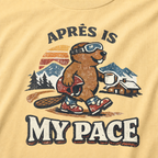 Close-up of a vintage beaver après-ski design with mountains, a cabin, and the words “Après Is My Pace” on a butter yellow t-shirt.