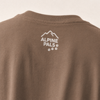 Espresso brown shirt with 'Alpine Pals' logo on a beige background