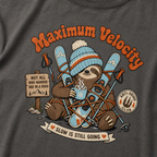 T-shirt with a sloth character holding skis and a cup, surrounded by text and graphics on a dark gray background.