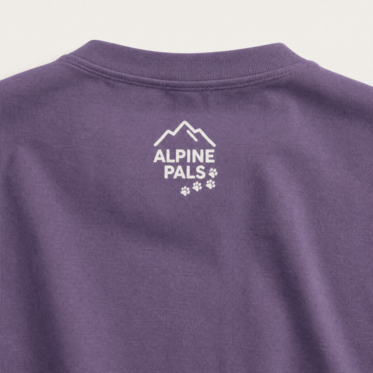 Grape purple shirt with 'Alpine Pals' logo on a white background