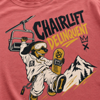 T-shirt with a graphic of a skier, chairlift, and mountain on a red background