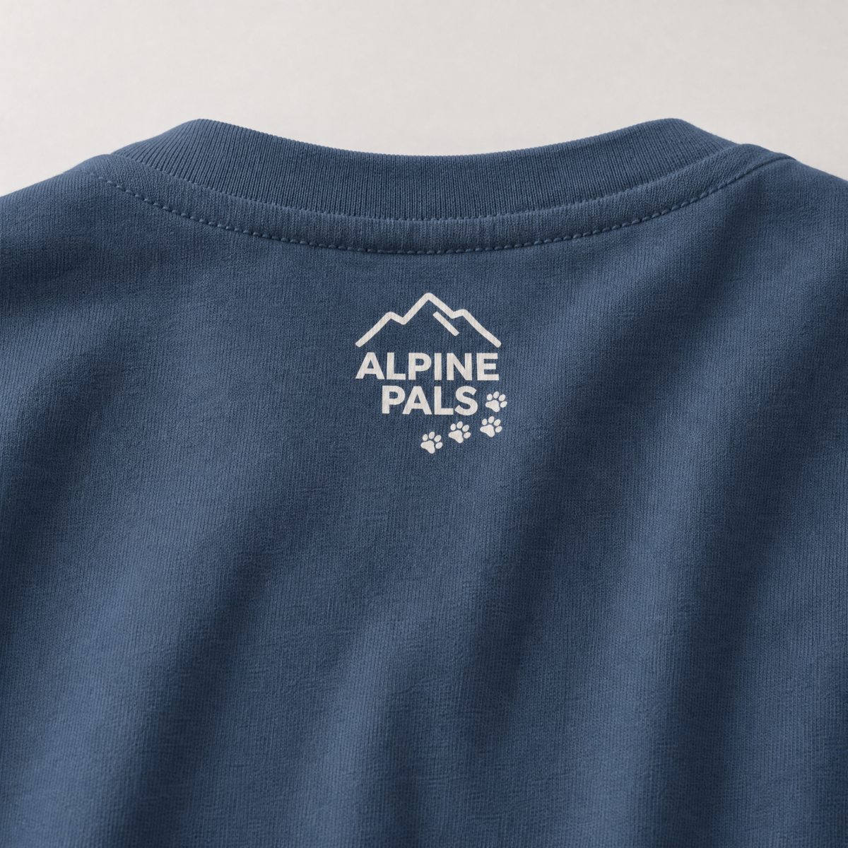 Midnight blue fabric with 'Alpine Pals' logo on a light gray background