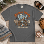 Pepper gray t-shirt with a sloth graphic and 'Maximum Velocity' text on a wooden surface with winter accessories.