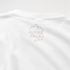 Close-up of a white shirt with 'Alpine Pals' logo on a light gray background