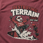 Brick red t-shirt with a graphic of a snowboarding rat and text on a red background