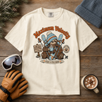 Ivory colored t-shirt with a sloth graphic and 'Maximum Velocity' text on a wooden surface with winter accessories.