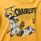 Mustard yellow t-shirt with a graphic of a skier and 'Chairlift Delinquent' text on a yellow background