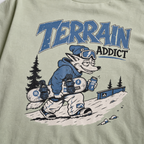 T-shirt with a graphic of a snowboarding fox and 'Terrain Addict' text on a light green background.