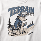 T-shirt with a cartoon raccoon wearing a blue jacket and snowboarding gear, with 'Terrain Addict' text.