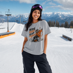 Person wearing a graphic t-shirt in a snowy mountain setting