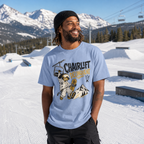 Person wearing a washed denim blue t-shirt with a graphic design in a snowy mountain setting