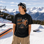 Person wearing a black t-shirt with graphic design and text in a snowy mountain setting