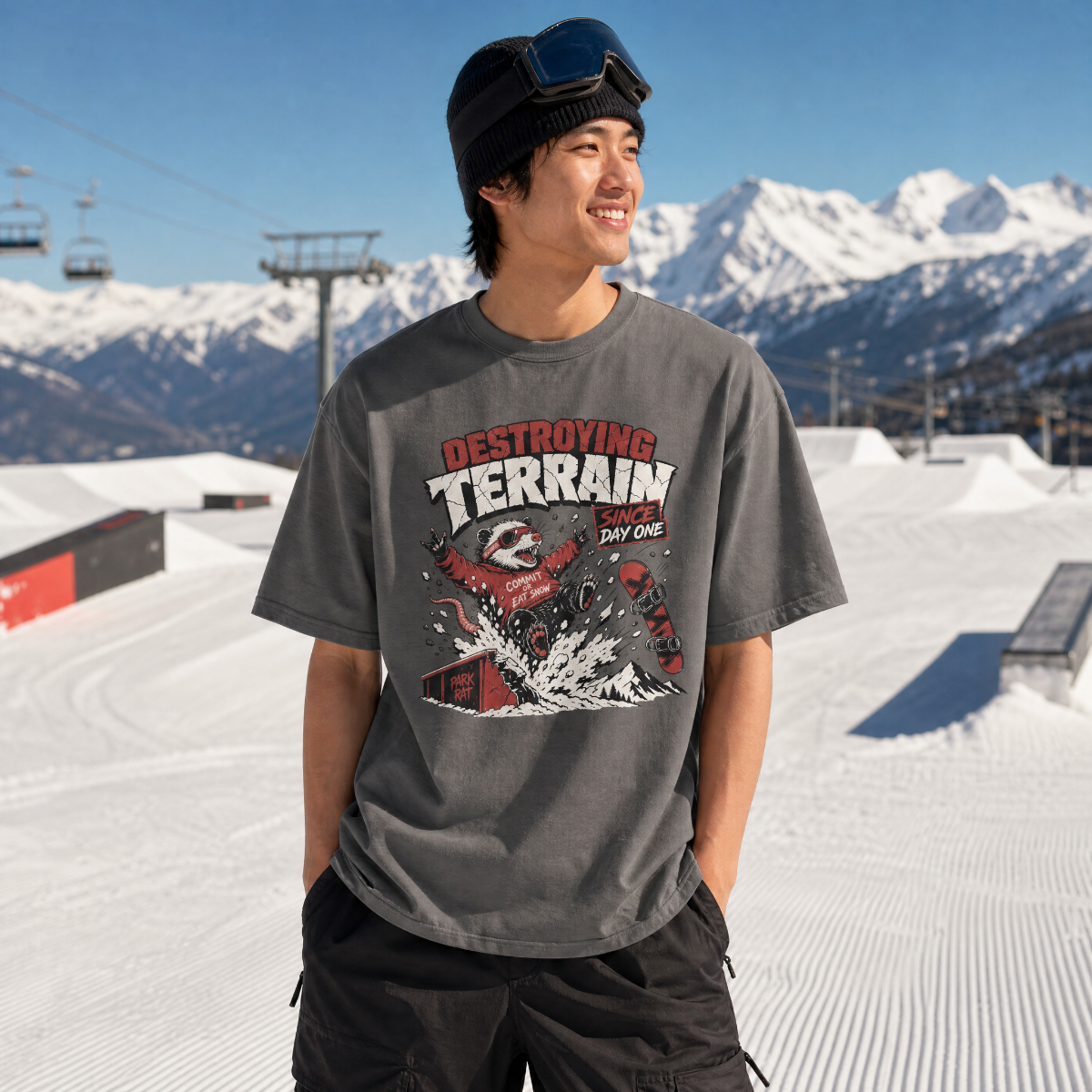 Person wearing a graphic t-shirt with a mountainous background