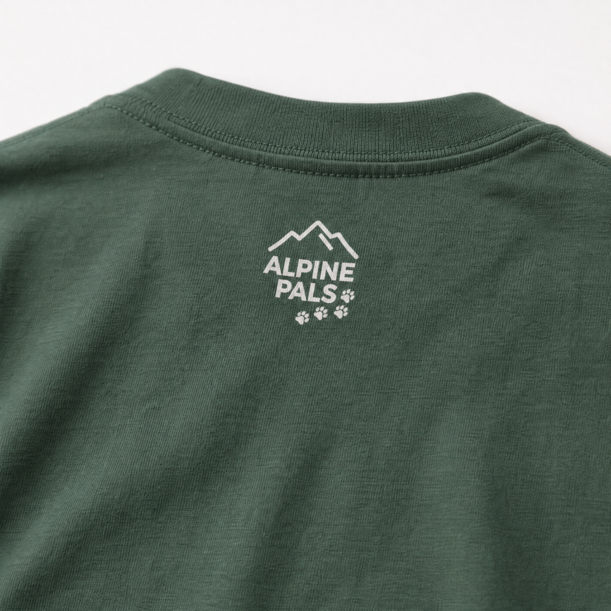 Blue spruce green t-shirt with 'Alpine Pals' logo on a white background