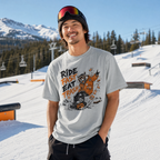 Person wearing a graphic t-shirt with a bear design and text in a snowy mountain setting