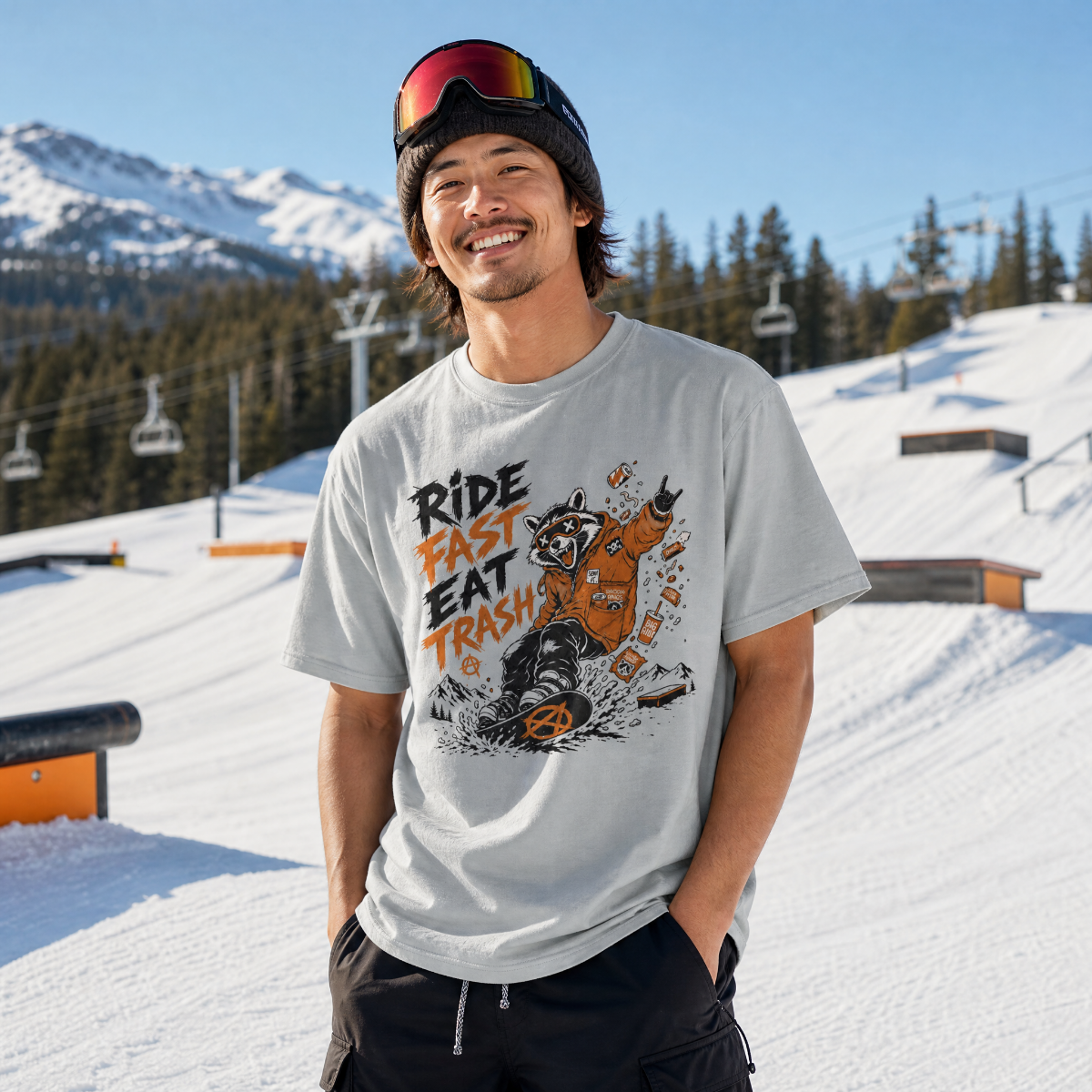 Person wearing a graphic t-shirt with a bear design and text in a snowy mountain setting