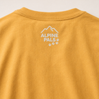 Yellow shirt with 'Alpine Pals' logo on a light background