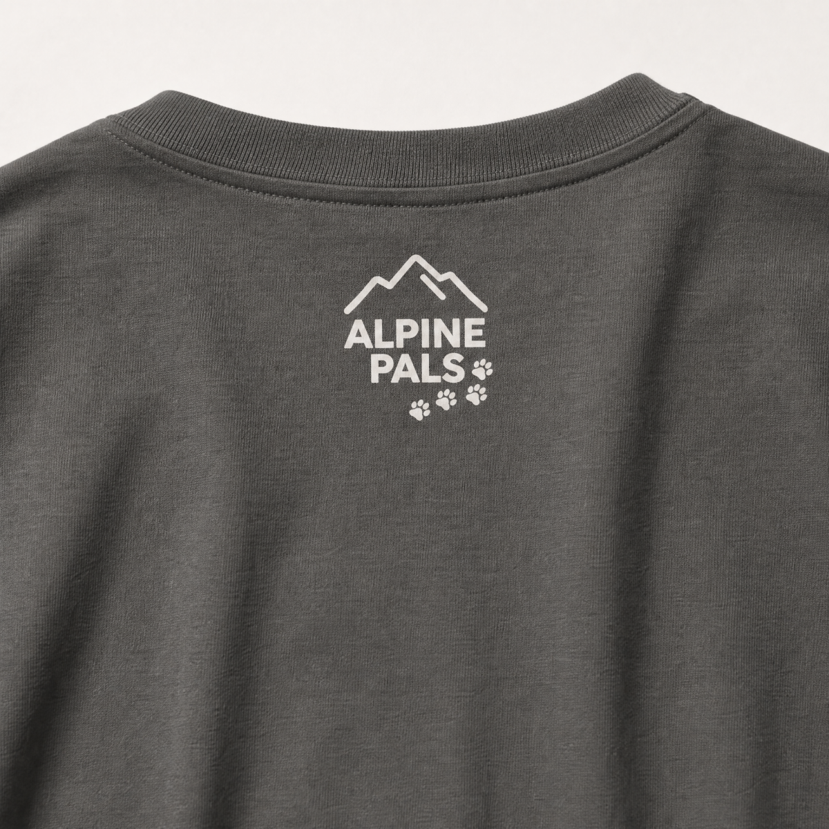 Pepper gray shirt with 'Alpine Pals' logo on a white background