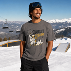 Man wearing a graphic t-shirt with a mountain design on a snowy slope