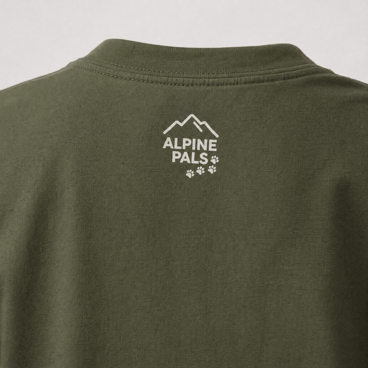 Hemp green t-shirt with 'Alpine Pals' logo on a white background