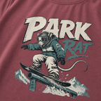 T-shirt with graphic of a rat on a snowboard and 'Park Rat' text on a Brick red background