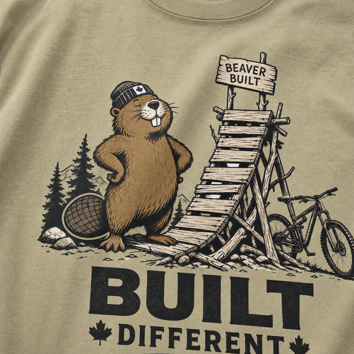 Khaki colored t-shirt with beaver graphic and 'Built Different' text.