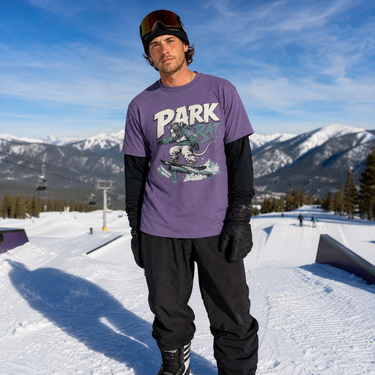 Person wearing a purple 'PARK' t-shirt with a mountainous background