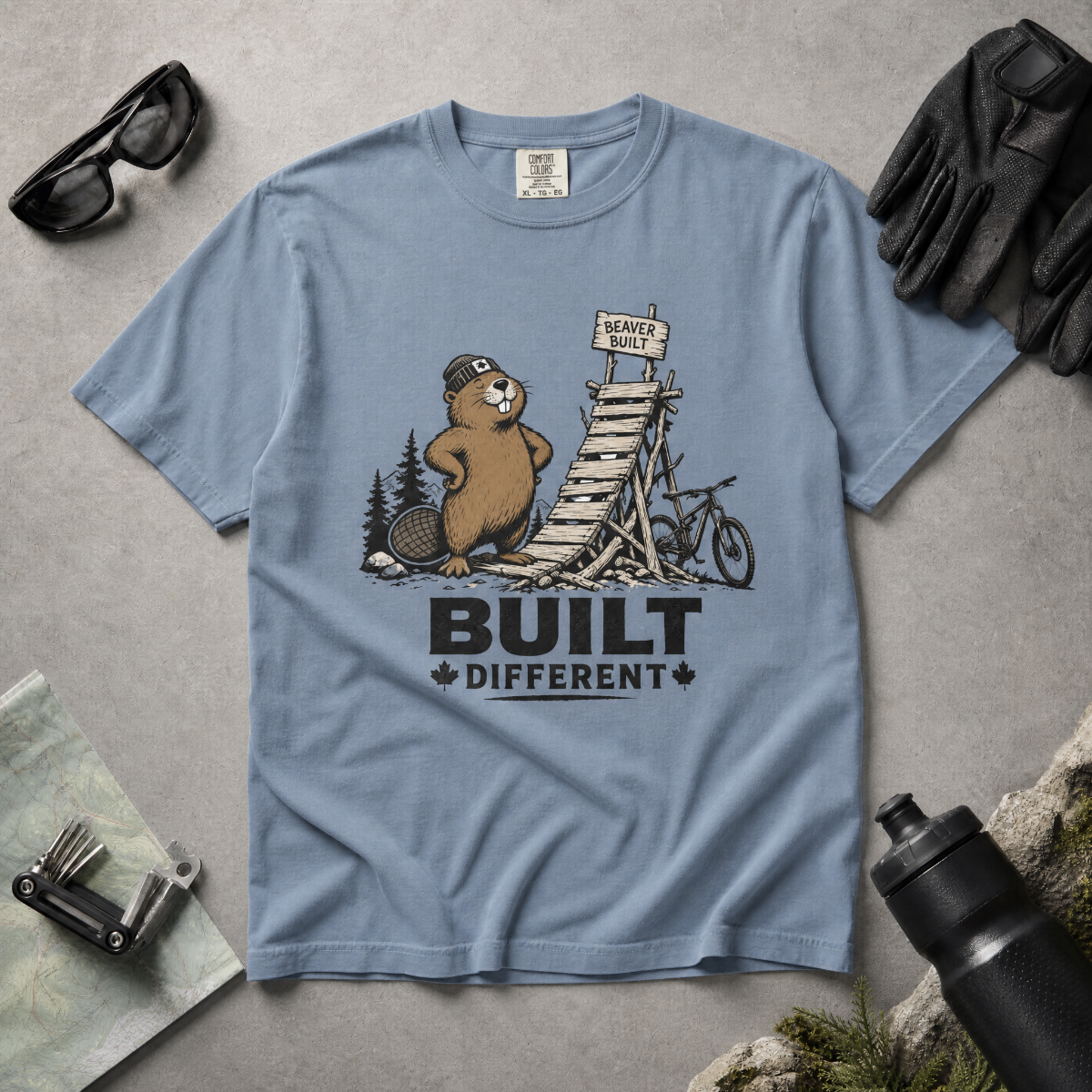 Blue jean colored t-shirt with a beaver graphic and 'Built Different' text.