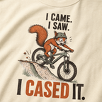Ivory white t-shirt with a graphic of a squirrel on a bike and text 'I came. I saw. I cased it.'