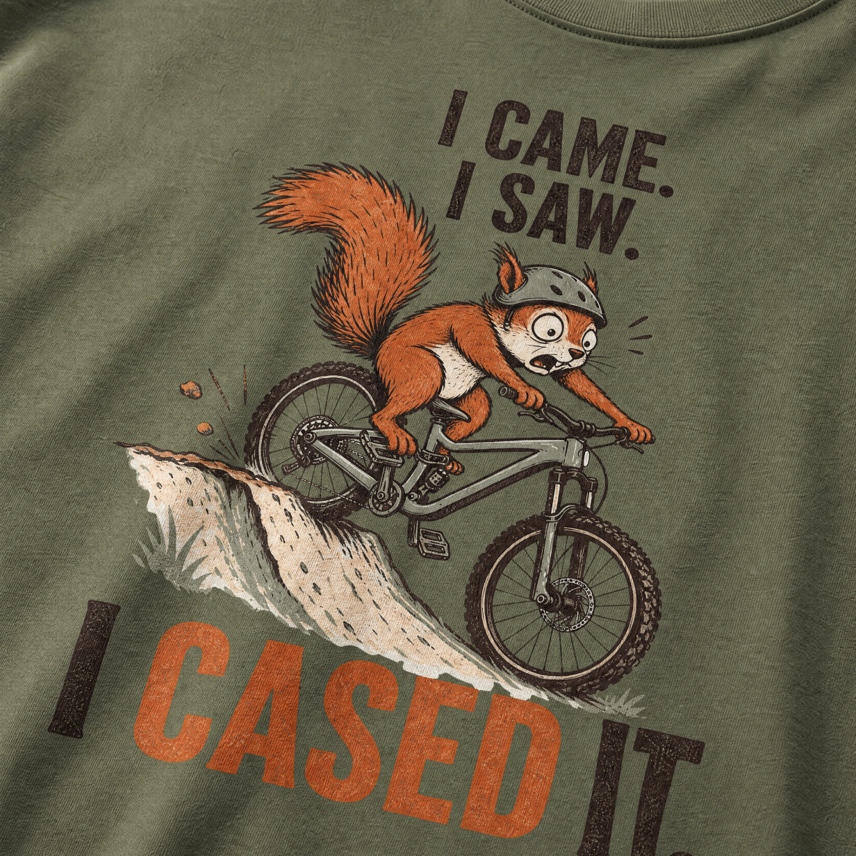 Moss green t-shirt with a graphic of a squirrel on a bike and humorous text.