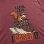 T-shirt with a graphic of a squirrel on a bike and text 'I Came. I Saw. I Cased It.'