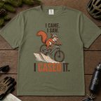 Moss green t-shirt with a graphic of a squirrel on a bike and text 'I Came. I Saw.