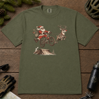 Hemp green t-shirt with Santa Claus riding a bike and reindeer design on a wooden surface.