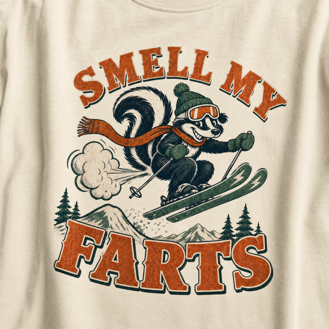 T-shirt with a skier squirrel graphic and 'Smell my Farts' text on an ivory white background