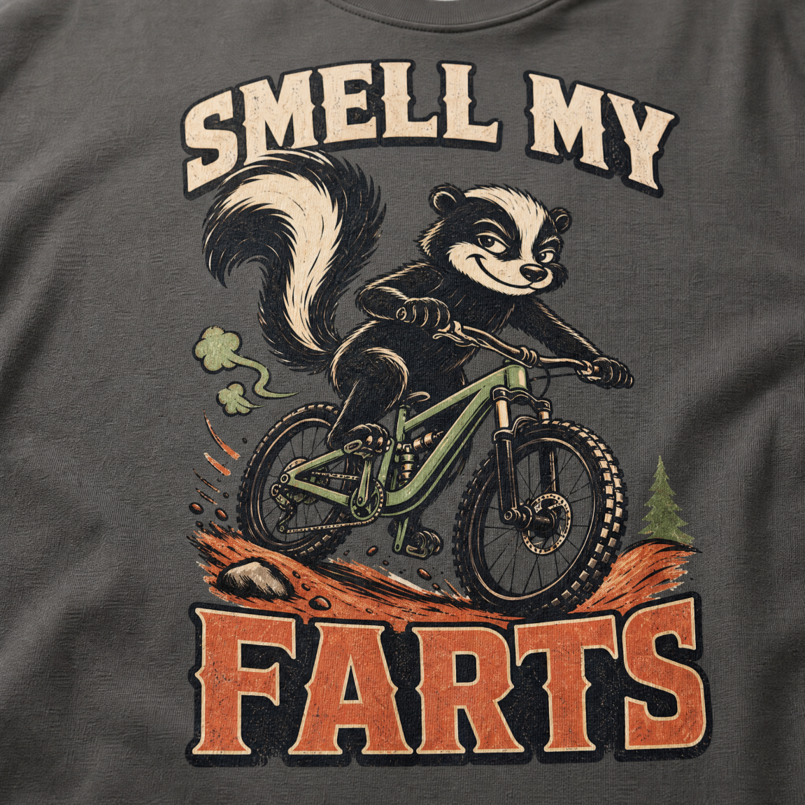 Pepper gray t-shirt with a graphic of a raccoon on a bike and text 'Smell my Farts'.