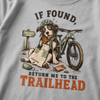 Granite gray t-shirt with a graphic of a dog with a bicycle and text 'If found, return me to the trailhead'.