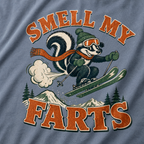 T-shirt design with a skunk skiing and text 'Smell my farts' on a blue jean background