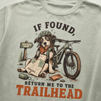 Bay green t-shirt with a dog and bicycle graphic and text 'If found, return me to the trailhead'.