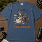 Midnight blue t-shirt with a graphic of a dog with a bicycle and text 'If Found, Return Me to the Trailhead' on a wooden surface.