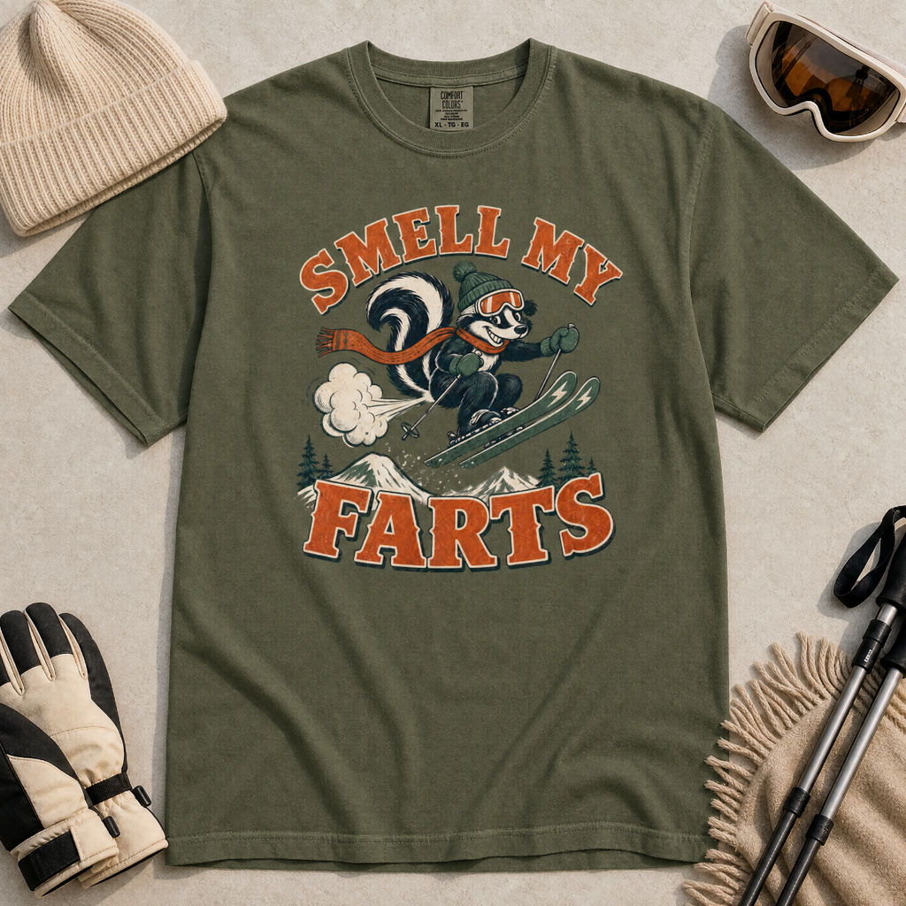 Hemp green t-shirt with a graphic design and text, surrounded by winter accessories on a light background